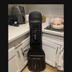 Vintage leather guitar carrying case with backpack straps