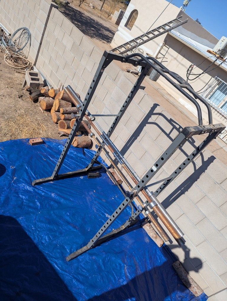Squat Rack, Barbells, And Weight Plates
