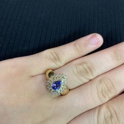 Lady's Yellow 14 Karat Ring With 1 Pear Shaped Tanzanites And 36= Round Cut Diamonds
