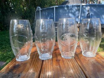 4 football shaped glass cups