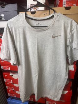 Nike white dri fit shirt size large used slightly elongated in back, Nike sign came off