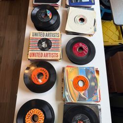 Vintage 45 RPM Vinyl Records Collection with Sleeves