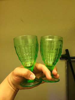Vaseline Glass or Uranium Glass. Not a pair. Two different style of globlets