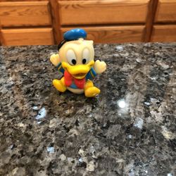 Vintage Very Old Disney Donald Duck Squeezeable Soft Vinyl / Rubber Figure.  Size 2 1/2 inches Tall .  Preowned .  Has been on display in a cabinet wi