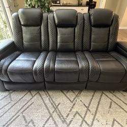 Black reclinable leather sofa