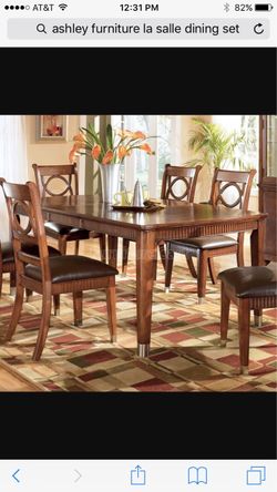 Solid wood, Ashley dining table +6 dining chairs plus custom table pad Solid wood, Ashley dining table +6 dining chairs + custom table pad.  EXCELLENT