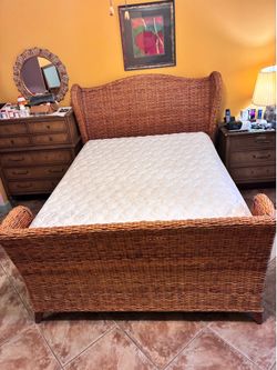 Queen size Pottery Barn Rattan bedframe with mattress.