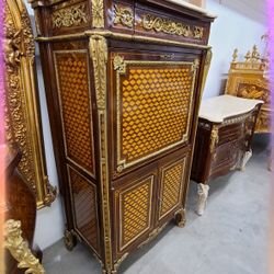  Curio Secretaire à Abattant  LOOK UP This is a Louis XVI style secretaire à abattant. TIME PERIOD  Louis XVI Era ORIGIN France HISTORY  The secrétair