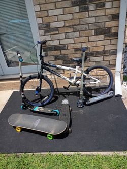 One bike two scooter and two skateboard
