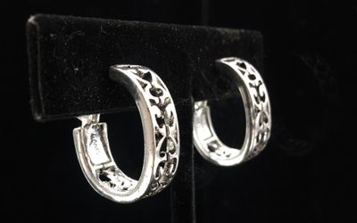 Silver tone clip on earrings signed MONET