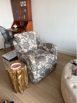 Two swivel arm chairs