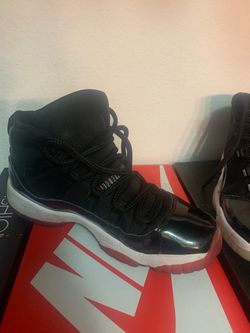 Air Jordan 11 Retro Black Patent Leather Sneakers