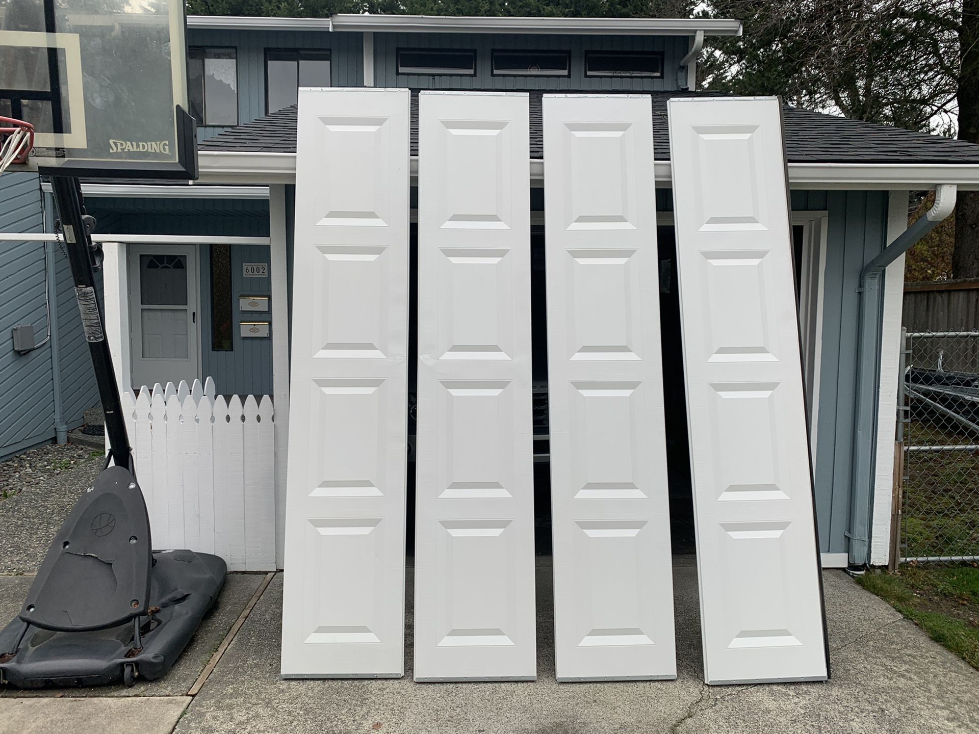 Clopay garage door fully insulated white solid door vinyl back