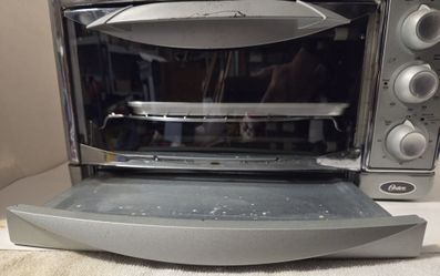 Oster Toaster Oven Model # 6297  60 Hz . 120 VAC 1500 W . 17"W , 9" H , 11" D.