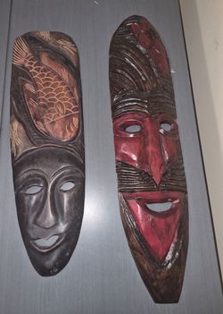 Pair of hand-carved wooden masks from Ghana, Africa