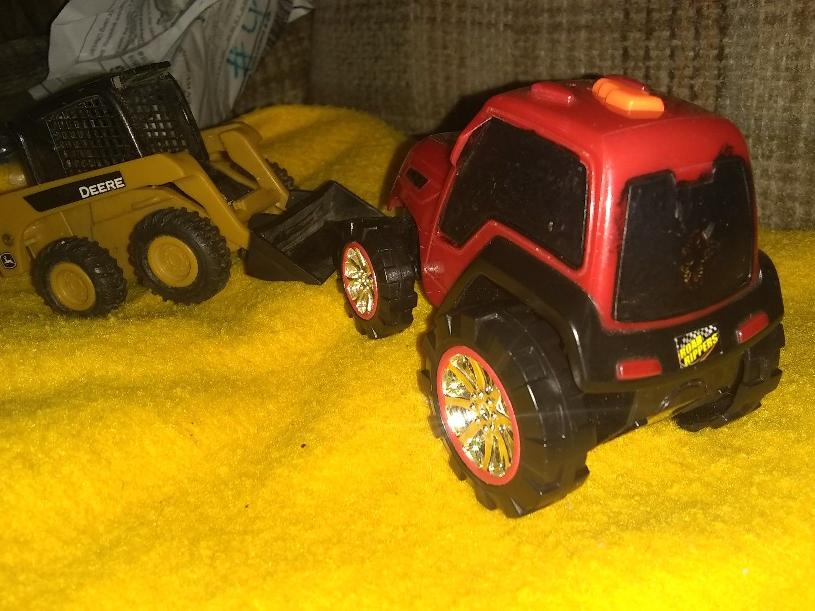 A John Deere mini front in loader & a road rippers tractor!