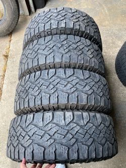 4) 275/65/18 Goodyear Wrangler Duratrac Tires  Old Range C  Tread measures 8-9/32  Light cracking between the tread, common on all terrains   DOT 2722