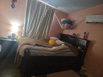 Double bed with mattress, drawers on both sides and side dresser