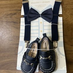 0-12 Months Wander + Dream infant dress-up set including a navy bow tie, suspenders, and matching loafers