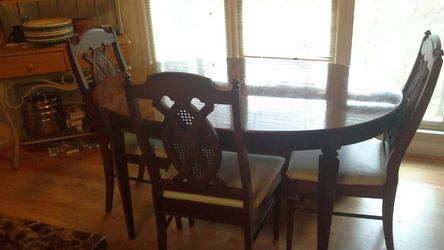 Antique table and 4 chairs.