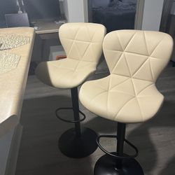 2 Beige Bar Stools Adjustable And Swivels