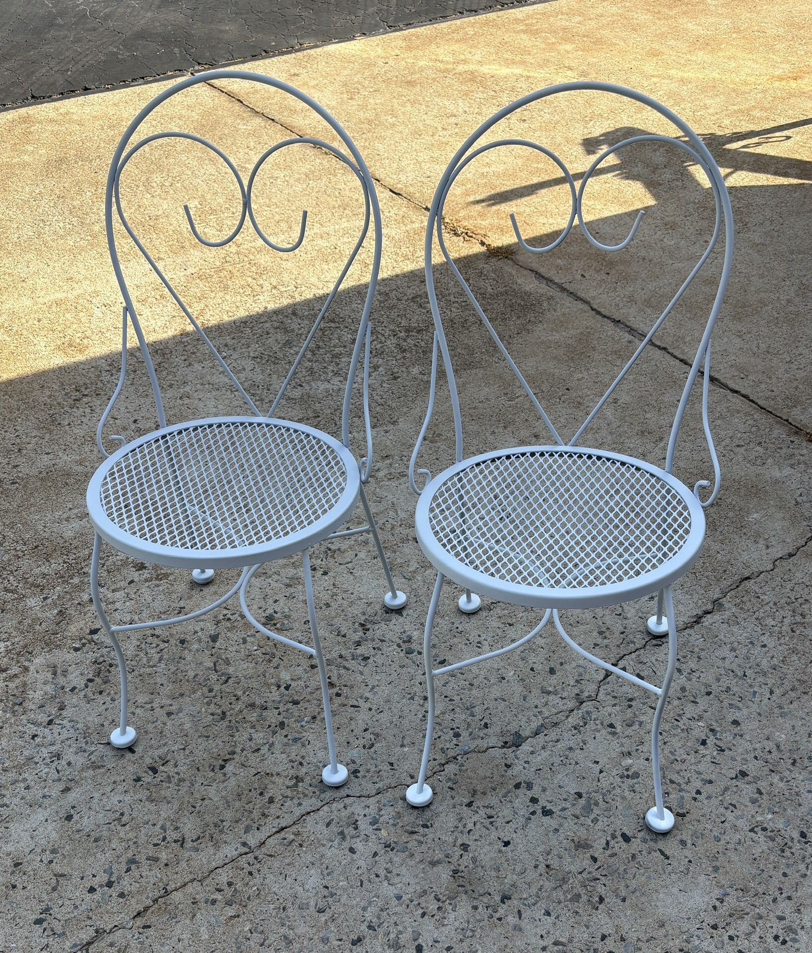 2 White Metal Chairs