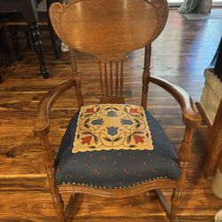 Antique wood and fabric rocking chair