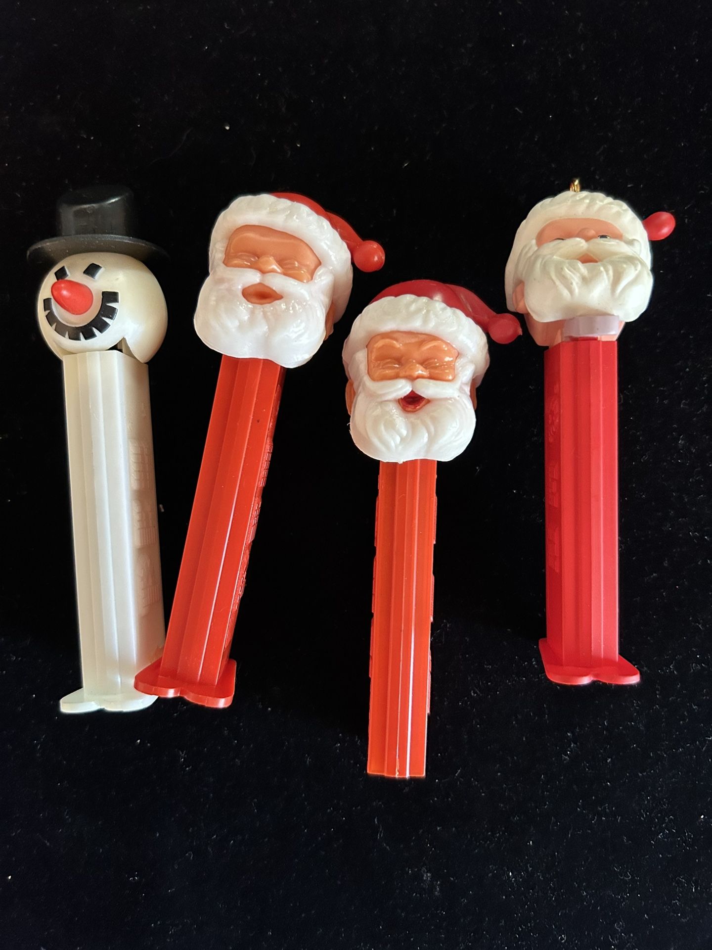 Four Pez Dispensers / 3 Santa’s & 1-Snowman