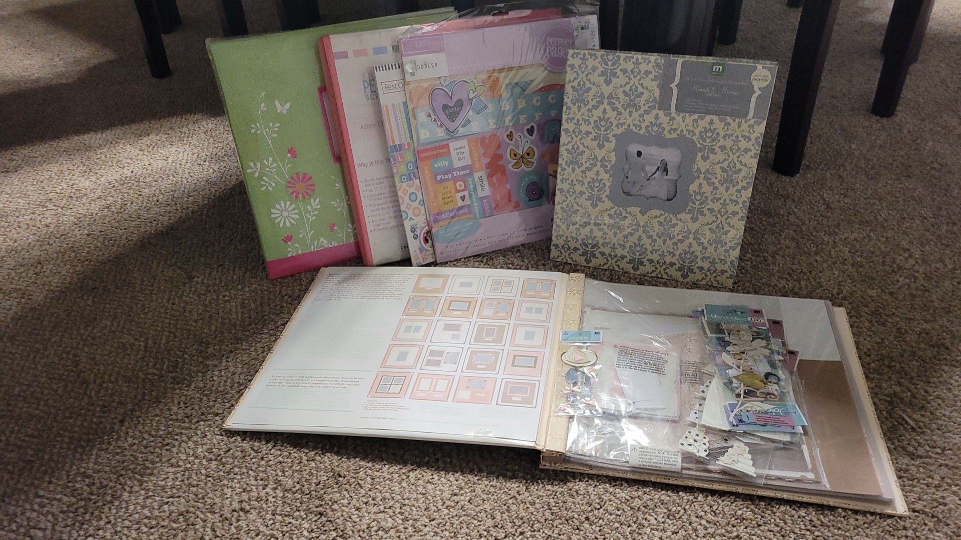 Scrapbooks, wedding and toddler. Wedding one includes alot of fancy additional stickers