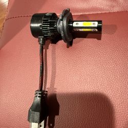 1/3 H4 12V 35/35W LED headlight bulb, black.