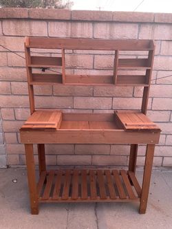 Potting bench table with display rack and hooks, storage shelf, hanger in brown