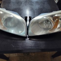 2011 Dodge caliber Heat Used Headlights W/ Bulbs