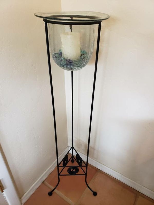Wrought iron and handblown glass floor stand candle holder. for Sale in