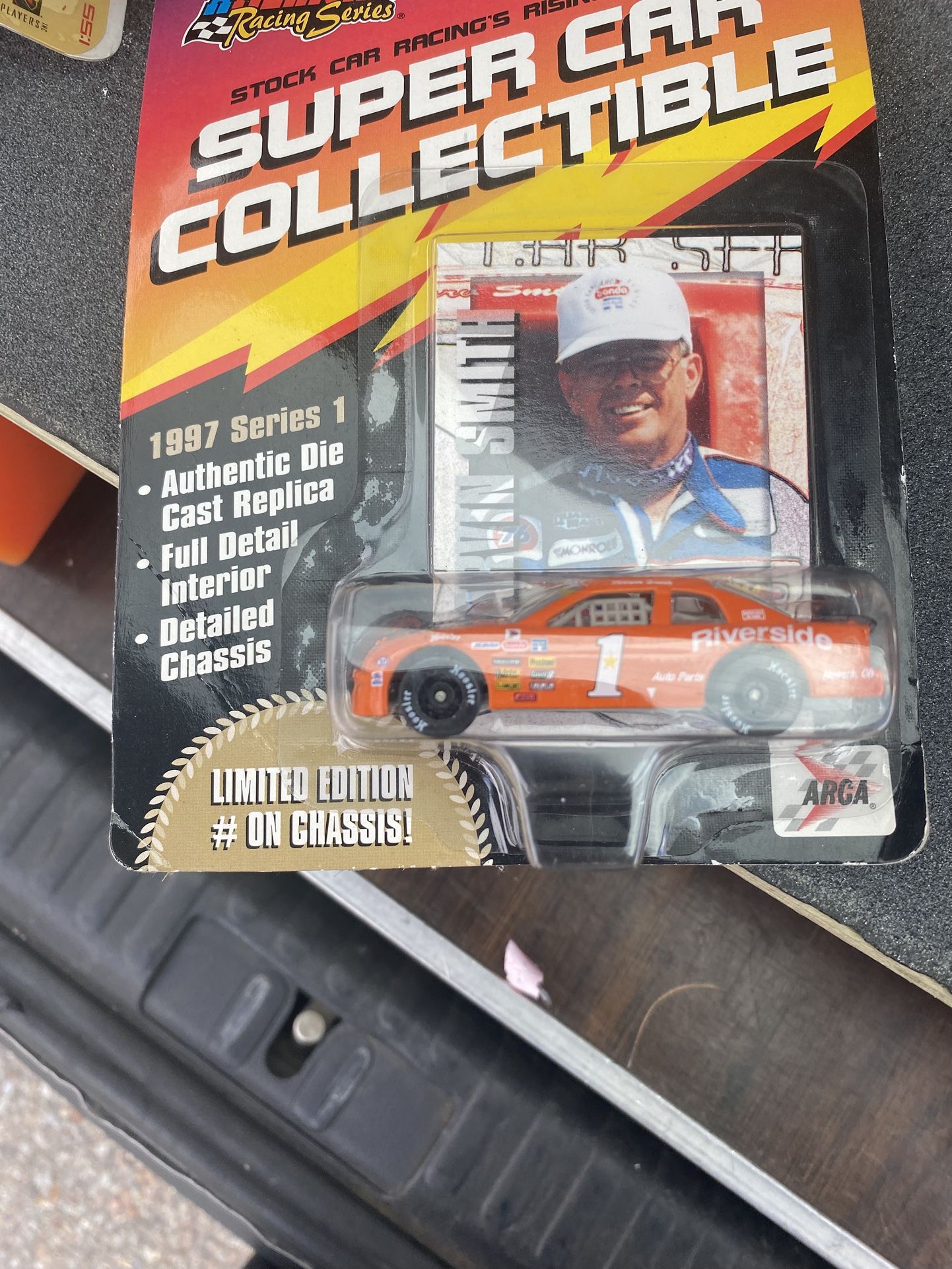 1997 American Racing Series 1:64 scale collectible die-cast car featuring Marvin Smith and his #1 Riverside race car. 