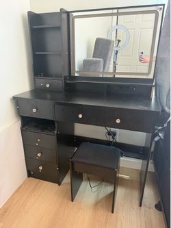 XL black vanity with plugs and lighted mirror