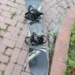 144cm Roxy snowboard with Burton bindings