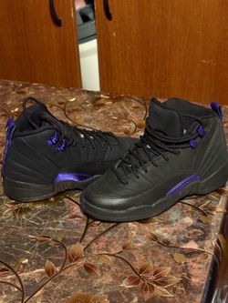 Air Jordan 12 Retro 'Dark Concord' features a black leather upper with metallic purple accents