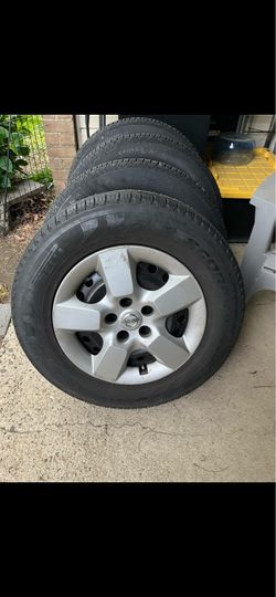Continental and Pirelli 215/70 R16 Tires with Nissan Steel Wheels