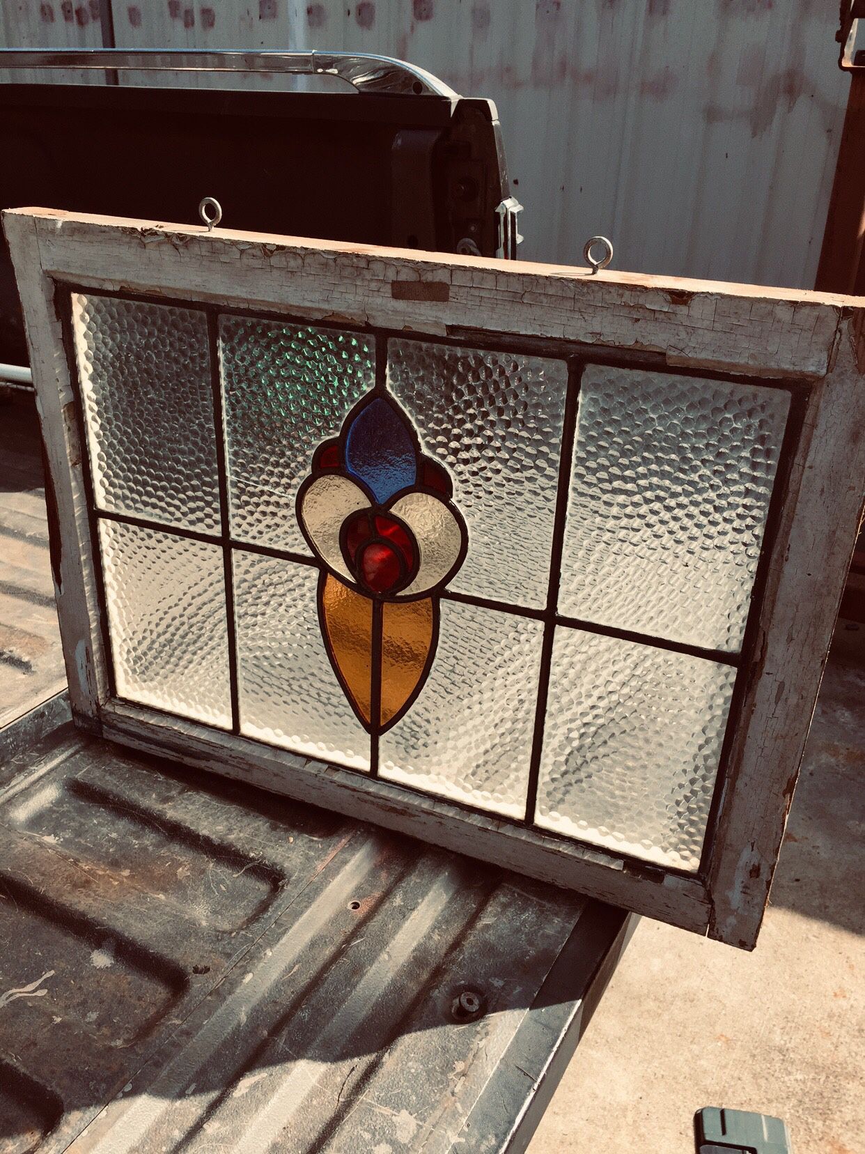 Vintage stain glass window. 27” long by 20” high by 1’ 1/2 thick.