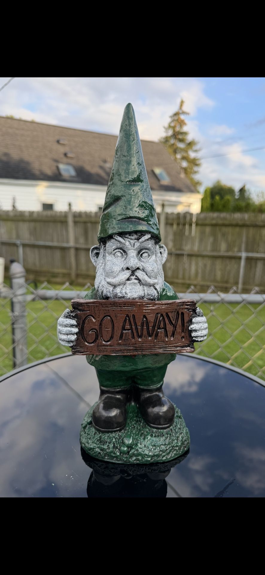 Gnome Holding Go Away Sign