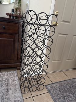 Mid-Century Modern wrought iron wine rack.