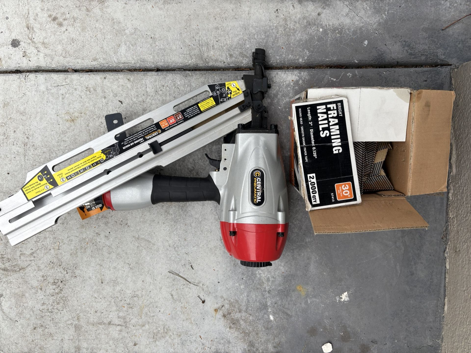Nail Gun And Box Of Framing Nails 