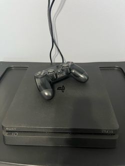 PlayStation 4 Slim 500 Gigabytes with Controller and 2 Games