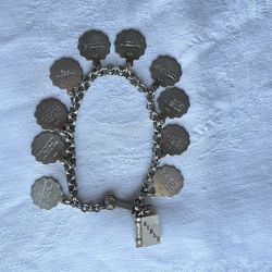 Antique Bible and 10 Commandments, abalone, silver and metal charm bracelet circa 1970s or earlier