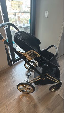 Jeremy Scott x CYBEX stroller angel wings