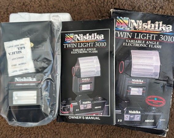 New Nishika N8000 3D Camera Twin Light 3010 Variable Angle Electronic Flash. Fits Most 35mm Cameras.