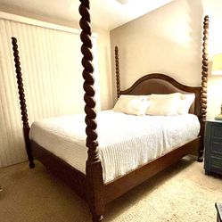 Elegant Z Gallerie King 4 poster bed featuring a solid wood frame with beautifully carved posts and a leather upholstered headboard