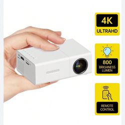 New Portable Projector, Mini Projector, Home Theater Movie- White In Box Remote   800 lumens  Great for camping trips  or small spaces   Connects and 