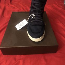 Never worn or even tried on Authentic Gucci high top sneakers size 8. Limited edition and can’t be found in stores. Paperwork from date of purchase a