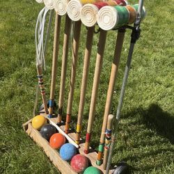 vintage croquet set, wooden mallets, solid wooden balls, wooden storage rack.